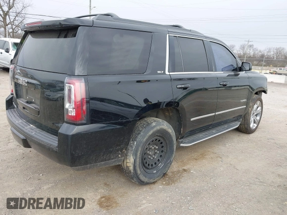 2016 GMC Yukon SLT with VIN 1GKS1BKC3GR272738, listed as a IAAI auction lot 41712439 with 169,726 mi miles. Bid and sale history available at carsss.com. Image 4.