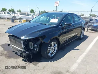 2016 Ford Fusion Titanium Hybrid z VIN 3FA6P0RUXGR123445, wystawiony jako IAAI lot #42606596 z przebiegiem 145 541 mil mil oraz . Historia ofert i sprzedaży dostępna na DreamBid. Obrazek 18.