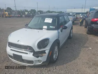 2015 MINI Countryman S with VIN WMWZC5C59FWM18935, listed as a IAAI auction lot 42427878 with 121,410 mi miles and . Bid and sale history available at DreamBid. Image 2.