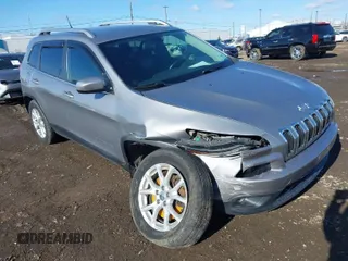 2014 Jeep Cherokee Latitude with VIN 1C4PJMCBXEW107559, listed as a IAAI auction lot 41859246 with 94,812 mi miles and . Bid and sale history available at DreamBid. Image 1.