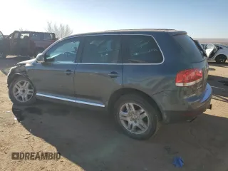 2004 Volkswagen Touareg z VIN WVGEM77L64D051760, wystawiony jako Copart lot #87044304 z przebiegiem Nie podano mil oraz Szkoda całkowita • Salvage title. Historia ofert i sprzedaży dostępna na DreamBid. Obrazek 2.