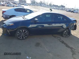 2019 Toyota Corolla L with VIN 5YFBURHE7KP922064, listed as a IAAI auction lot 41977741 with 54,896 mi miles and . Bid and sale history available at DreamBid. Image 14.