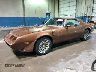 1979 Pontiac Firebird z VIN 2W87K9N184050, wystawiony jako Copart lot #75937874 z przebiegiem 18 509 mil mil oraz Szkody całkowita. Historia ofert i sprzedaży dostępna na DreamBid. Obrazek 1.