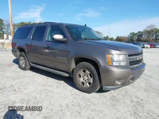 2011 Chevrolet Suburban LT with VIN 1GNSCJE00BR122636, listed as a IAAI auction lot 41594772 with 202,433 mi miles. Bid and sale history available at carsss.com. Image 1.