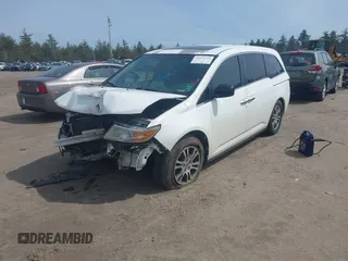 2012 Honda Odyssey EX-L with VIN 5FNRL5H65CB082916, listed as a IAAI auction lot 42052713 with 217,267 mi miles and . Bid and sale history available at carsss.com. Image 2.