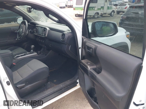 2022 Toyota Tacoma SR with VIN 3TMCZ5AN1NM478457, listed as a IAAI auction lot 42479107 with 59,547 mi miles and . Bid and sale history available at DreamBid. Image 5.