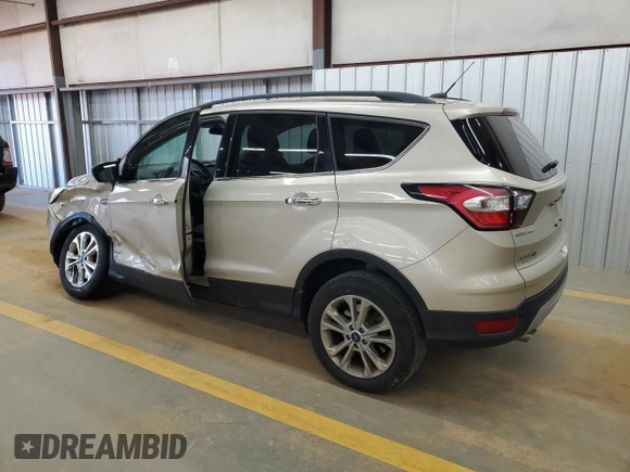 2017 Ford Escape SE with VIN 1FMCU9GD2HUD30317, listed as a Copart auction lot 50541085 with 80,421 mi miles and Salvage Title. Bid and sale history available at DreamBid. Image 2.