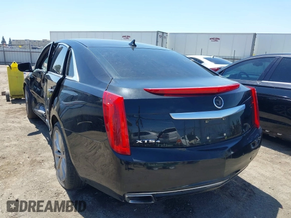 2013 Cadillac XTS Luxury z VIN 2G61R5S32D9226506, wystawiony jako IAAI lot #42208105 z przebiegiem 140 255 mil mil oraz . Historia ofert i sprzedaży dostępna na DreamBid. Obrazek 3.