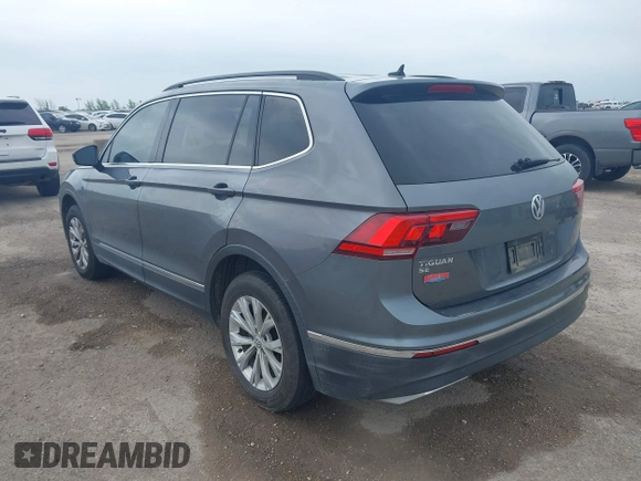 2018 Volkswagen Tiguan SEL with VIN 3VV3B7AX3JM000585, listed as a IAAI auction lot 41905836 with 99,114 mi miles and . Bid and sale history available at DreamBid. Image 3.