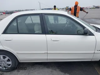 2000 Mazda Protege DX with VIN JM1BJ2220Y0273953, listed as a IAAI auction lot 41956058 with 158,837 mi miles and . Bid and sale history available at DreamBid. Image 13.