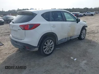 2014 Mazda CX-5 Grand Touring with VIN JM3KE4DY0E0343777, listed as a IAAI auction lot 41464395 with 126,214 mi miles. Bid and sale history available at carsss.com. Image 4.