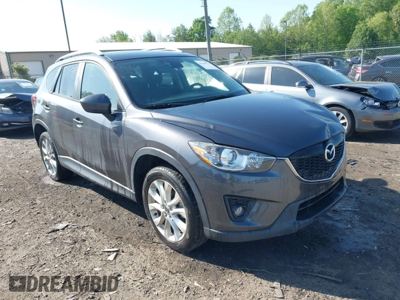 2014 Mazda CX-5 Grand Touring with VIN JM3KE4DY2E0312952, listed as a IAAI auction lot 42138721 with 99,993 mi miles and . Bid and sale history available at DreamBid. Image 1.