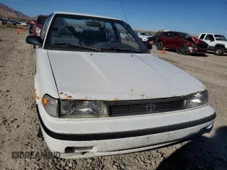 1992 Toyota Corolla z VIN JT2AE94A1N0300157, wystawiony jako Copart lot #77783474 z przebiegiem 180 103 mil mil oraz Czysty tytuł • Clean title. Historia ofert i sprzedaży dostępna na DreamBid. Obrazek 5.
