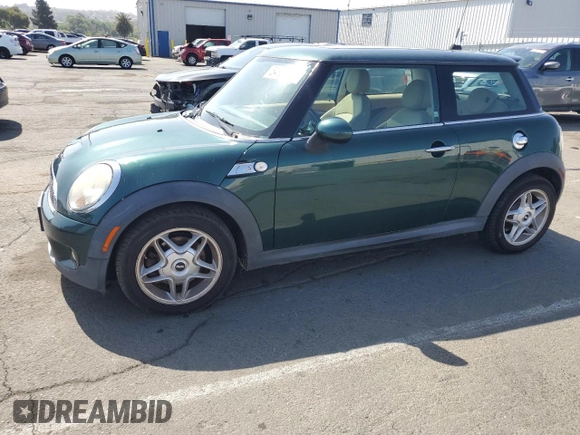 2009 MINI Hardtop S with VIN WMWMF73539TW85698, listed as a Copart auction lot 54957685 with 98,429 mi miles and Clean Title. Bid and sale history available at DreamBid. Image 1.