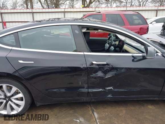 2018 Tesla Model 3 Long Range Battery with VIN 5YJ3E1EB3JF090567, listed as a IAAI auction lot 41568312 with 35,327 mi miles and . Bid and sale history available at DreamBid. Image 14.