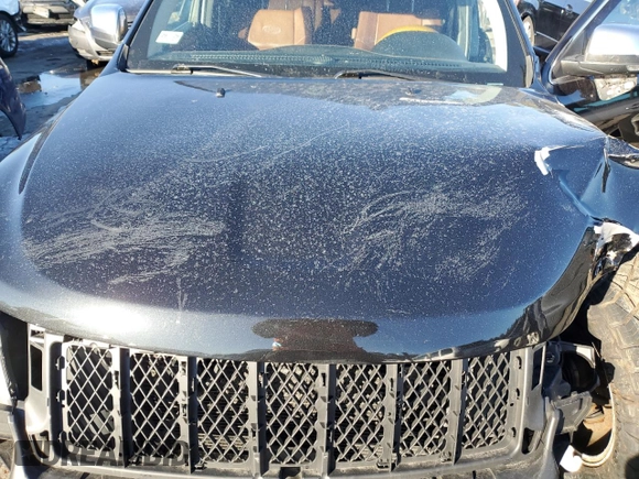 2013 Jeep Grand Cherokee Overland with VIN 1C4RJFCTXDC525097, listed as a Copart auction lot 42250875 with 214,368 mi miles and Salvage Title. Bid and sale history available at carsss.com. Image 12.
