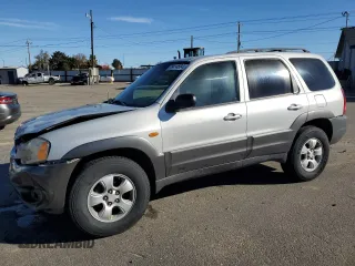 2004 Mazda Tribute LX with VIN 4F2YZ04154KM15773, listed as a Copart auction lot 79414684 with 210,041 mi miles and Salvage Title. Bid and sale history available at DreamBid. Image 1.