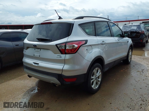 2018 Ford Escape SEL with VIN 1FMCU9HD6JUB24230, listed as a IAAI auction lot 42112408 with 104,447 mi miles. Bid and sale history available at carsss.com. Image 4.