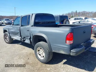 2004 Dodge Dakota Sport with VIN 1D7HG38K84S608161, listed as a IAAI auction lot 41863394 with 145,288 mi miles and . Bid and sale history available at DreamBid. Image 3.