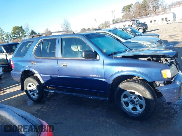 2004 Isuzu Rodeo S with VIN 4S2CK58W444314265, listed as a IAAI auction lot 41294636 with 291,080 mi miles and . Bid and sale history available at DreamBid. Image 13.