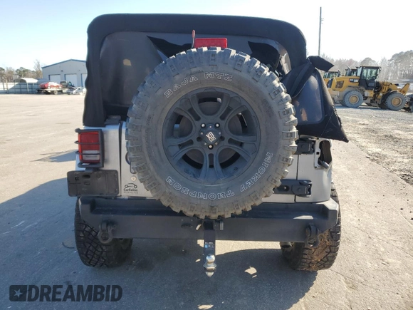2015 Jeep Wrangler Unlimited Wrangler X with VIN 1C4BJWEG7FL580885, listed as a Copart auction lot 48891605 with 104,448 mi miles and Salvage title. Bid and sale history available at DreamBid. Image 6.
