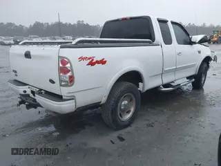 1999 Ford F-150 XL with VIN 1FTRX18L6XNB48352, listed as a IAAI auction lot 41717057 with 171,654 mi miles. Bid and sale history available at carsss.com. Image 4.