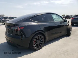 2023 Tesla Model Y Performance with VIN 7SAYGDEF9PF947667, listed as a Copart auction lot 52314795 with 40,634 mi miles and Salvage Title. Bid and sale history available at DreamBid. Image 3.