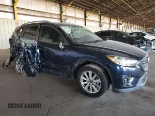 2016 Mazda CX-5 Touring with VIN JM3KE2CY7G0653854, listed as a Copart auction lot 74825564 with 139,193 mi miles and Salvage Title. Bid and sale history available at DreamBid. Image 4.