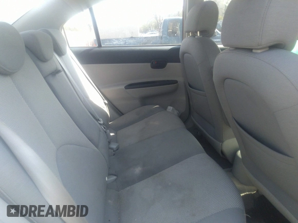 2006 Hyundai Accent GLS z VIN KMHCN46C66U027692, wystawiony jako IAAI lot #41796140 z przebiegiem 233 488 mil mil oraz . Historia ofert i sprzedaży dostępna na DreamBid. Obrazek 8.