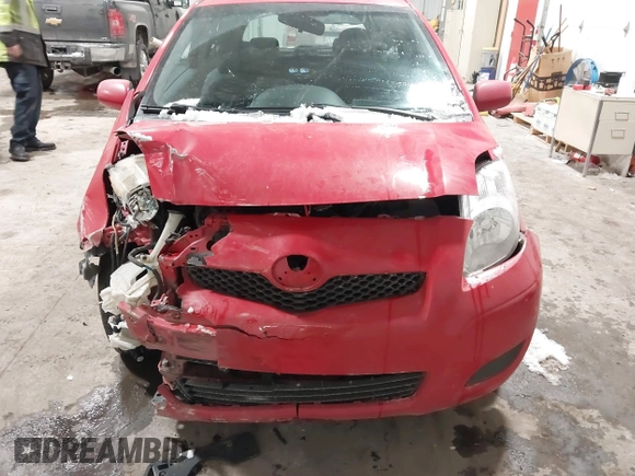2009 Toyota Yaris with VIN JTDJT903695262292, listed as a IAAI auction lot 41636204 with 157,986 mi miles. Bid and sale history available at carsss.com. Image 6.