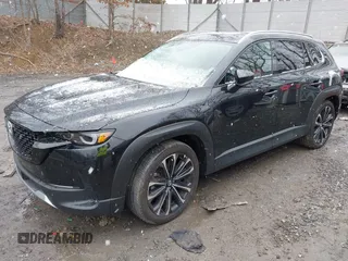 2024 Mazda CX-50 Premium z VIN 7MMVABDYXRN180263, wystawiony jako IAAI lot #41738791 z przebiegiem 9 688 mil mil oraz . Historia ofert i sprzedaży dostępna na DreamBid. Obrazek 22.