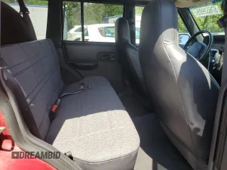 1999 Jeep Cherokee Sport z VIN 1J4FF68SXXL525944, wystawiony jako Copart lot #57653905 z przebiegiem 102 057 mil mil oraz Szkoda całkowita • Salvage title. Historia ofert i sprzedaży dostępna na DreamBid. Obrazek 11.