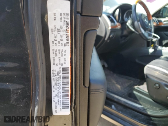 2013 Jeep Grand Cherokee Overland with VIN 1C4RJFCG5DC638927, listed as a Copart auction lot 52752615 with 117,494 mi miles and Salvage Title. Bid and sale history available at carsss.com. Image 13.