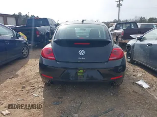 2012 Volkswagen Beetle 2.0T Turbo w/Sun/Snd/Nav PZEV with VIN 3VWVA7AT4CM655068, listed as a IAAI auction lot 41605197 with 115,546 mi miles. Bid and sale history available at carsss.com. Image 16.