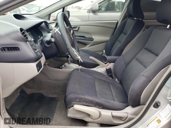 2010 Honda Insight EX with VIN JHMZE2H71AS039108, listed as a Copart auction lot 54557145 with 151,230 mi miles and Salvage title. Bid and sale history available at DreamBid. Image 7.