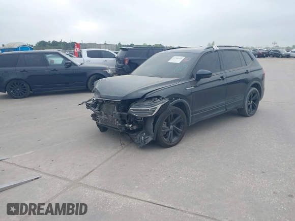 2023 Volkswagen Tiguan SE R-Line Black with VIN 3VVCB7AX1PM106543, listed as a IAAI auction lot 41784559 with 39,846 mi miles and . Bid and sale history available at DreamBid. Image 2.