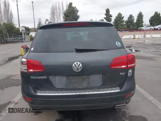 2013 Volkswagen Touareg Exec z VIN WVGEP9BP7DD010339, wystawiony jako IAAI lot #41094662 z przebiegiem 91 280 mil mil oraz . Historia ofert i sprzedaży dostępna na DreamBid. Obrazek 15.