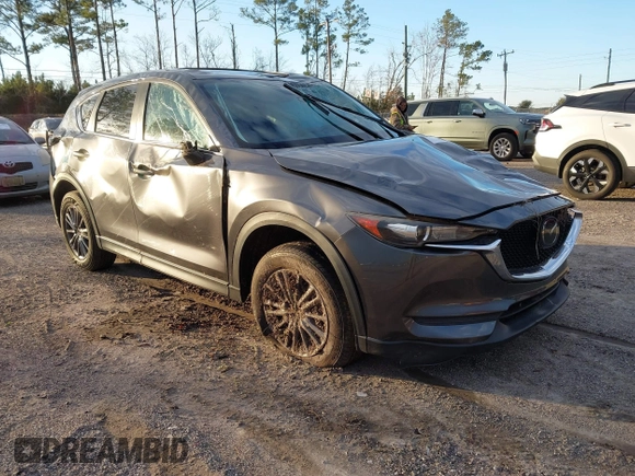 2019 Mazda CX-5 Touring with VIN JM3KFACM8K0694362, listed as a IAAI auction lot 41410185 with 89,443 mi miles. Bid and sale history available at carsss.com. Image 1.