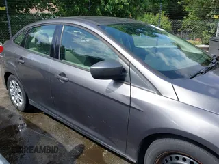 2012 Ford Focus SE z VIN 1FAHP3F22CL125941, wystawiony jako IAAI lot #42176898 z przebiegiem 157 940 mil mil oraz . Historia ofert i sprzedaży dostępna na DreamBid. Obrazek 13.