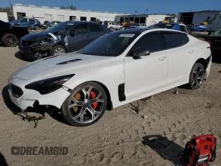 2021 Kia Stinger GT2 with VIN KNAE55LC1M6089121, listed as a Copart auction lot 74823434 with 25,009 mi miles and Salvage Title. Bid and sale history available at carsss.com. Image 1.