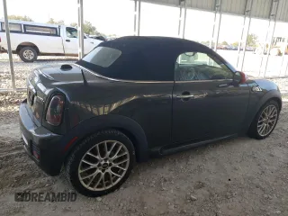 2015 MINI Roadster S z VIN WMWSY3C59FT566785, wystawiony jako Copart lot #73574064 z przebiegiem 96 623 mil mil oraz Tytuł czysty. Historia ofert i sprzedaży dostępna na DreamBid. Obrazek 3.