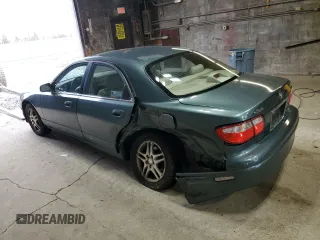 2000 Mazda Millenia z VIN JM1TA2212Y1610919, wystawiony jako Copart lot #80375014 z przebiegiem 127 938 mil mil oraz Szkody całkowita. Historia ofert i sprzedaży dostępna na DreamBid. Obrazek 2.