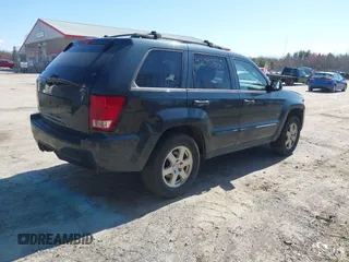 2008 Jeep Grand Cherokee Laredo with VIN 1J8GR48K98C161239, listed as a IAAI auction lot 42090850 with 218,063 mi miles. Bid and sale history available at carsss.com. Image 4.