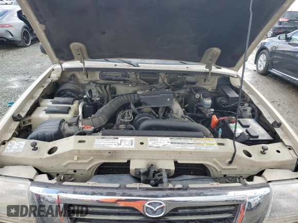 1999 Mazda B-Series Truck SX z VIN 4F4YR12C4XTM21614, wystawiony jako Copart lot #49276195 z przebiegiem 155 420 mil mil oraz Czysty tytuł • Clean title. Historia ofert i sprzedaży dostępna na DreamBid. Obrazek 11.