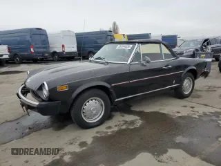 1975 FIAT 124 Spider z VIN 124CS10095845, wystawiony jako Copart lot #86344634 z przebiegiem 86 863 mil mil oraz Czysty tytuł • Clean title. Historia ofert i sprzedaży dostępna na DreamBid. Obrazek 1.