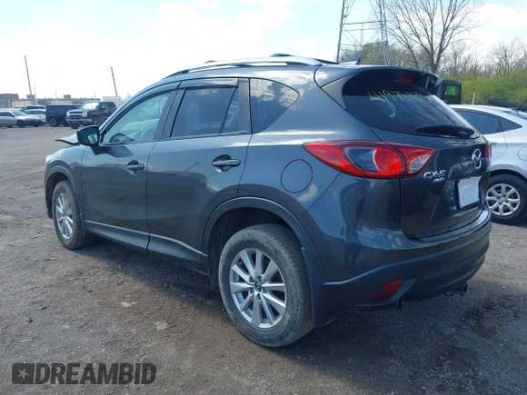2016 Mazda CX-5 Touring with VIN JM3KE4CYXG0620990, listed as a IAAI auction lot 41978738 with 91,237 mi miles and . Bid and sale history available at carsss.com. Image 3.