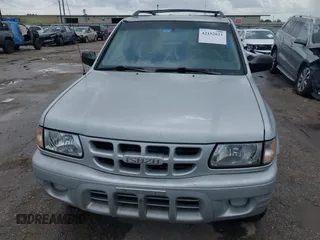 2001 Isuzu Rodeo S with VIN 4S2DM58WX14352481, listed as a IAAI auction lot 42152621 with 162,696 mi miles. Bid and sale history available at carsss.com. Image 6.