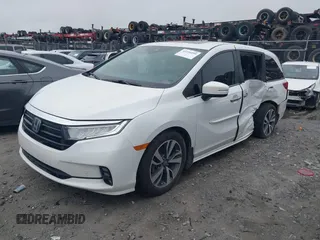 2022 Honda Odyssey Touring with VIN 5FNRL6H87NB058420, listed as a IAAI auction lot 42234499 with 78,633 mi miles and . Bid and sale history available at DreamBid. Image 2.