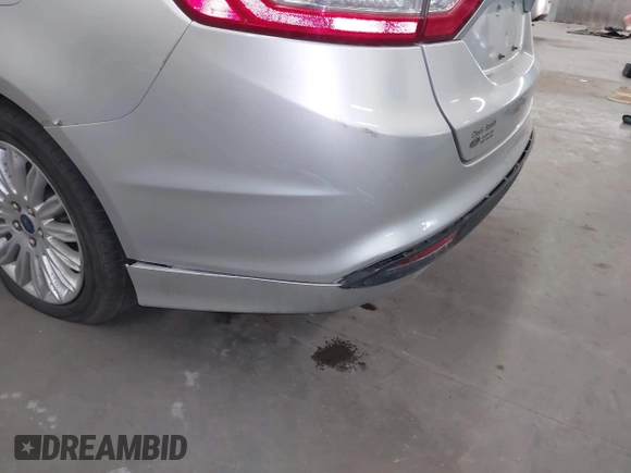 2013 Ford Fusion SE Hybrid with VIN 3FA6P0LU7DR228691, listed as a IAAI auction lot 42055540 with 144,389 mi miles and . Bid and sale history available at DreamBid. Image 6.