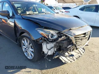 2014 Mazda 3 S Grand Touring with VIN JM1BM1W36E1112033, listed as a IAAI auction lot 41412655 with 115,050 mi miles and . Bid and sale history available at DreamBid. Image 6.